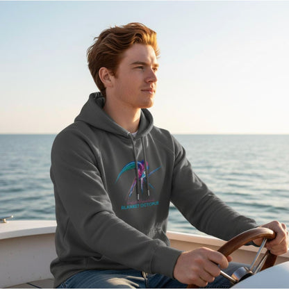 Man wearing the organic Hoodie in Charcoal Grey with Blanket Octopus design by seablub on a boat at sea