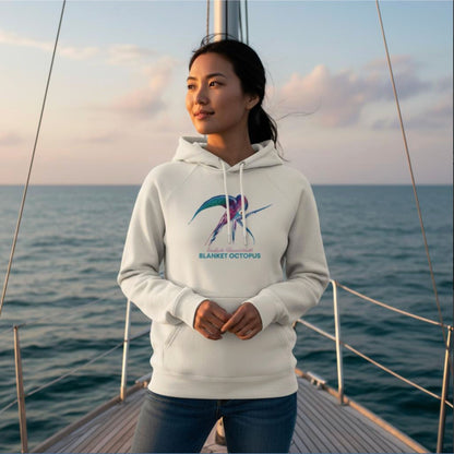 Woman wearing the organic Hoodie in Off-White with Blanket Octopus design by seablub on a sailing boat at sea