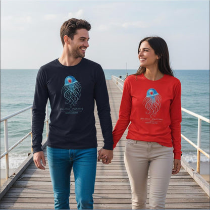 Two people wearing the organic unisex Long-Sleeve Shirts with the Immortal Jellyfish design by seablub in Black and Bright Red walking hand in hand on a wooden pier by the sea
