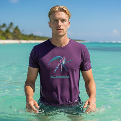 Front view of a unisex organic T-shirt in Astral Purple featuring the Blanket Octopus design by seablub, worn by a model standing in the ocean